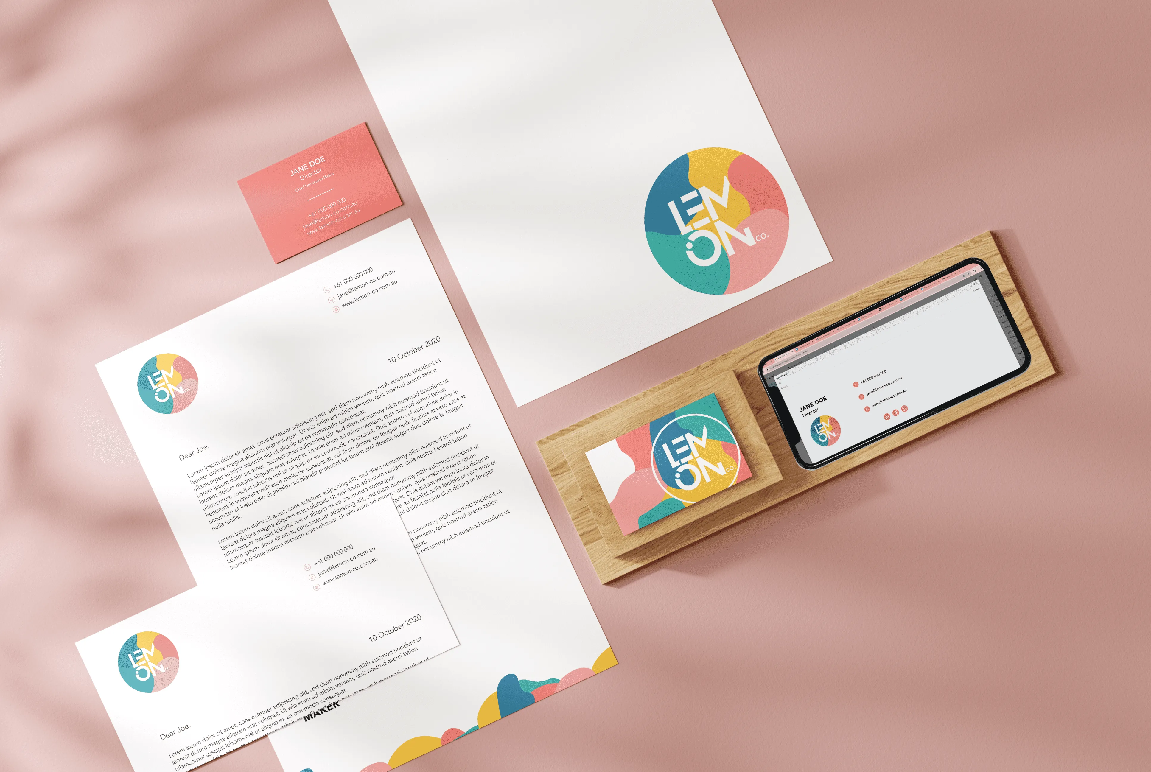 Mock up of business folder, letterhead, business card and email signature for Lemon Co.